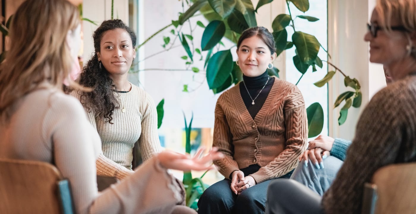 Group of women sitting in circling talking