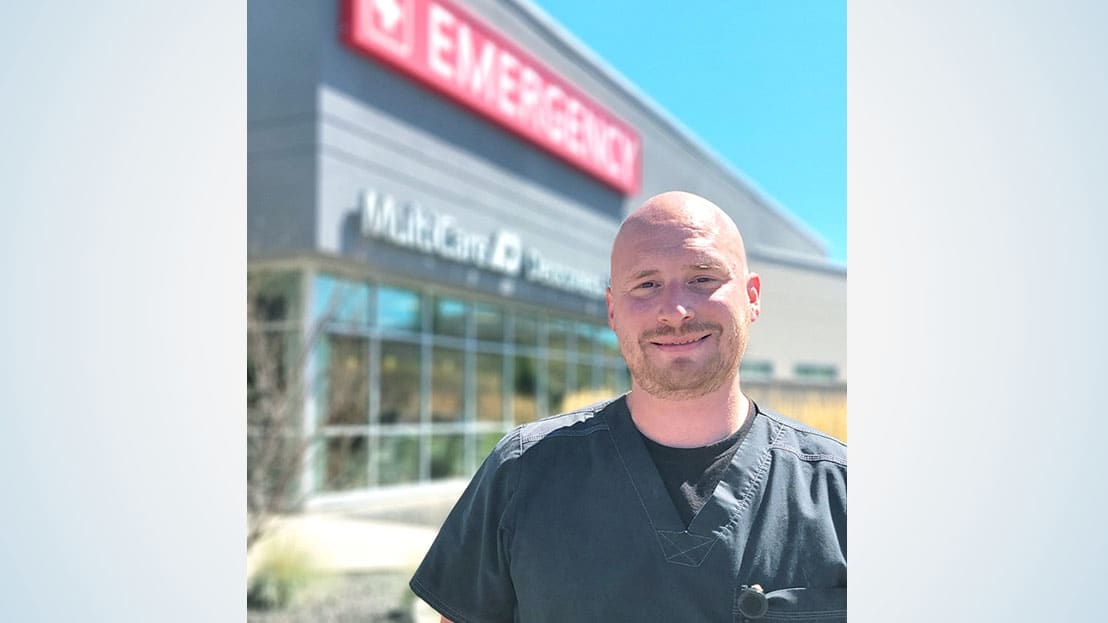 Man in front of hospital.