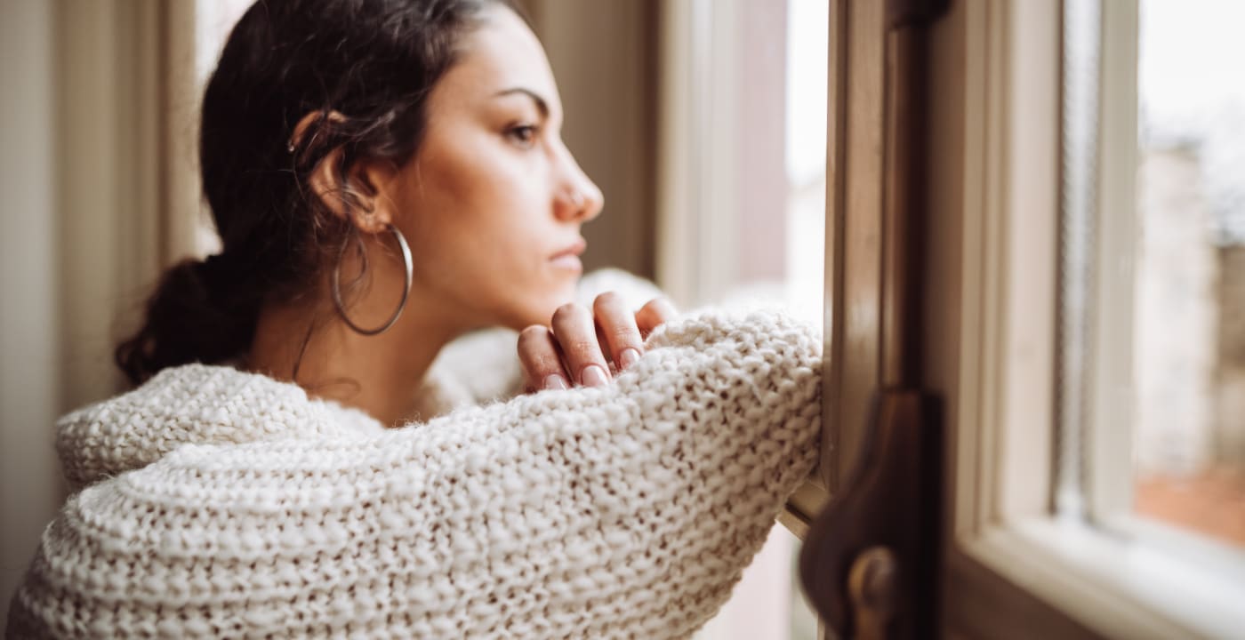 Woman staring out the window.