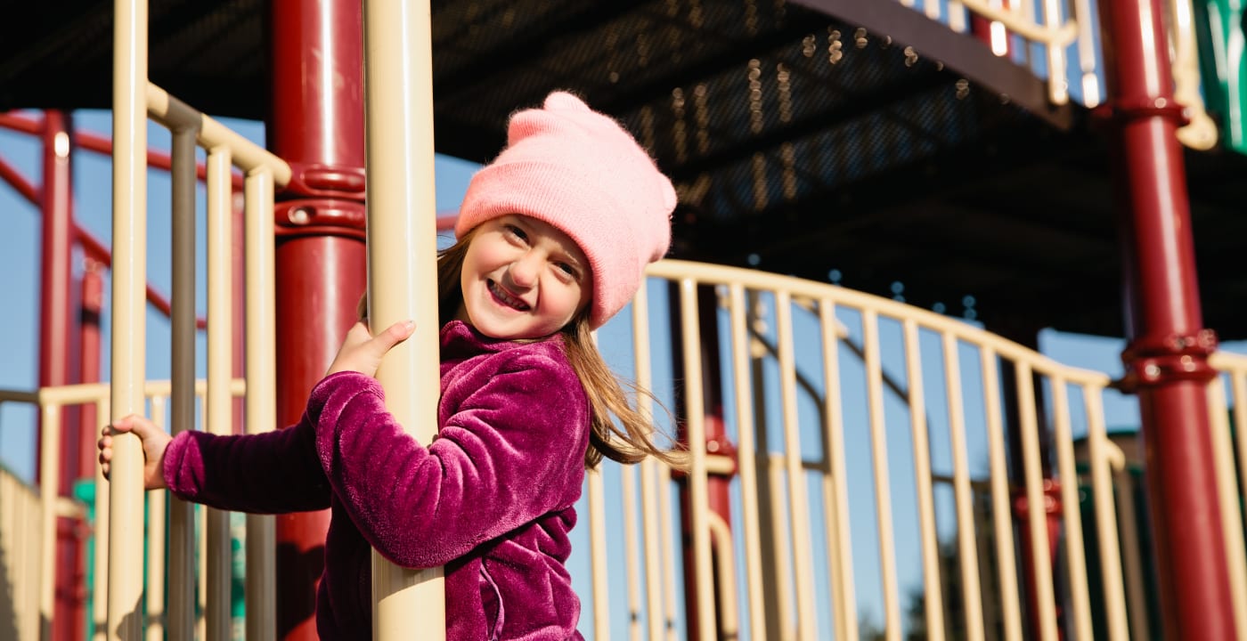 Little girl on playground smiling