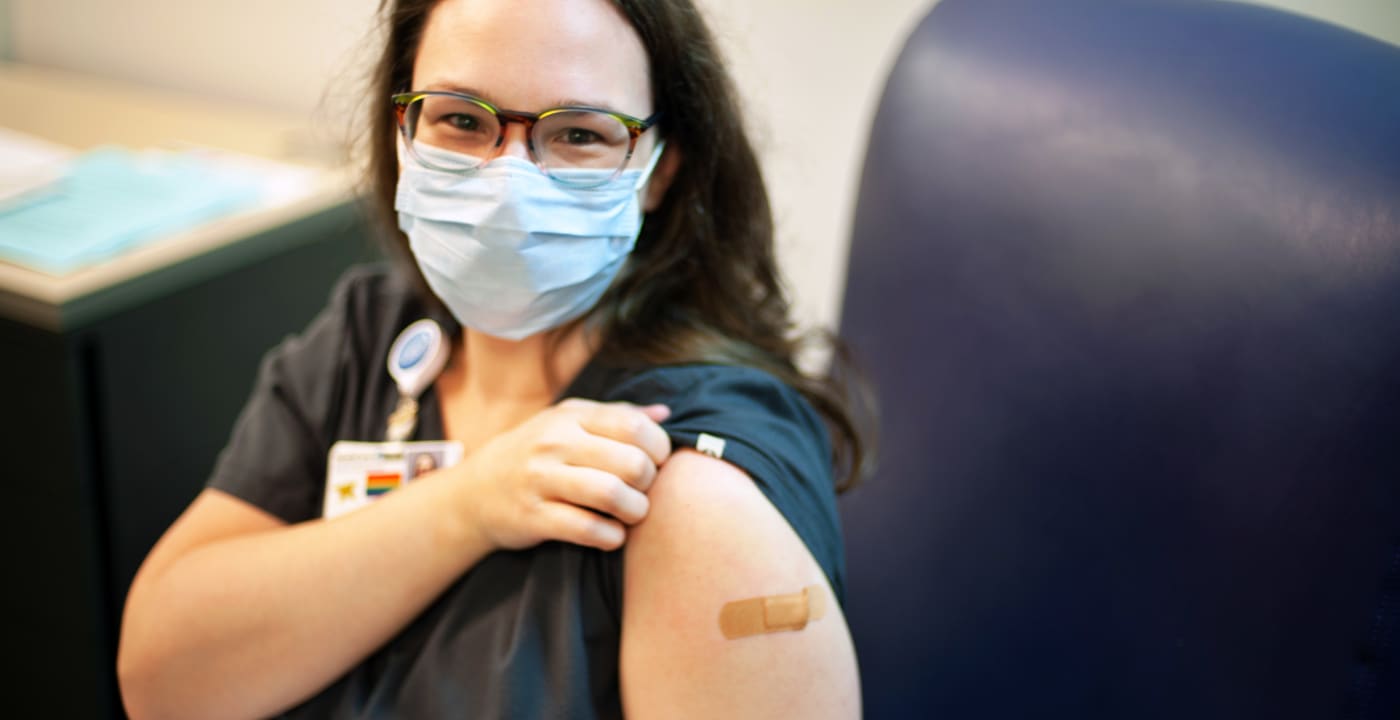 Woman getting COVID-19 vaccine