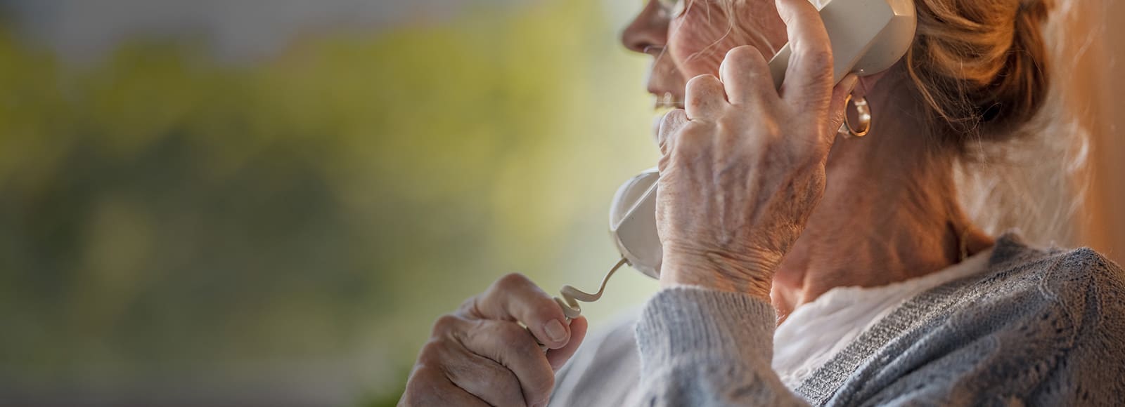 Senior on telephone