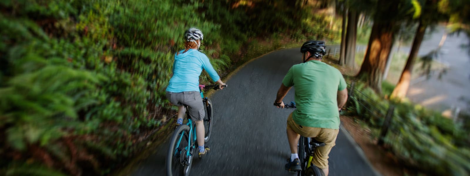 Couple biking in woods