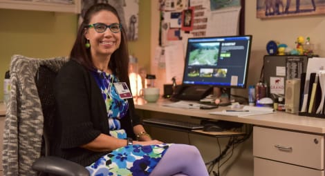 Nurse navigator sitting at her desk