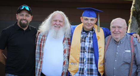 Four generations of men at high school graduation