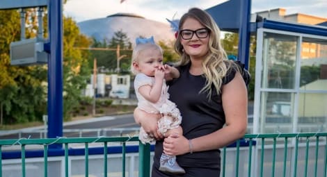 Mom and daughter smiling