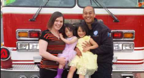 Family in front of a fire truck