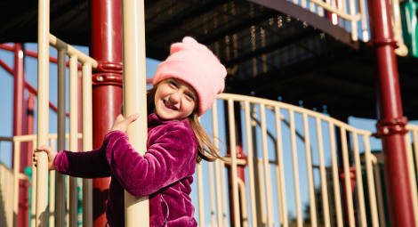 Little girl on playground smiling