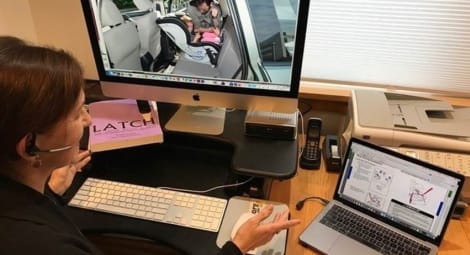 Woman helping to properly install a car seat virtually