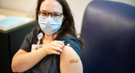 Woman getting COVID-19 vaccine