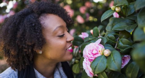 Woman smelling roses