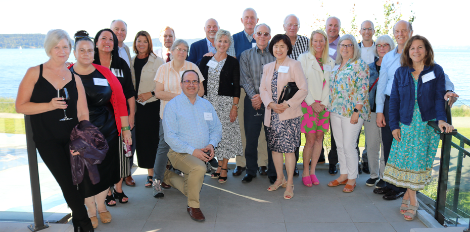 Capital Foundation Board of Directors poses for a photo on an outdoor patio