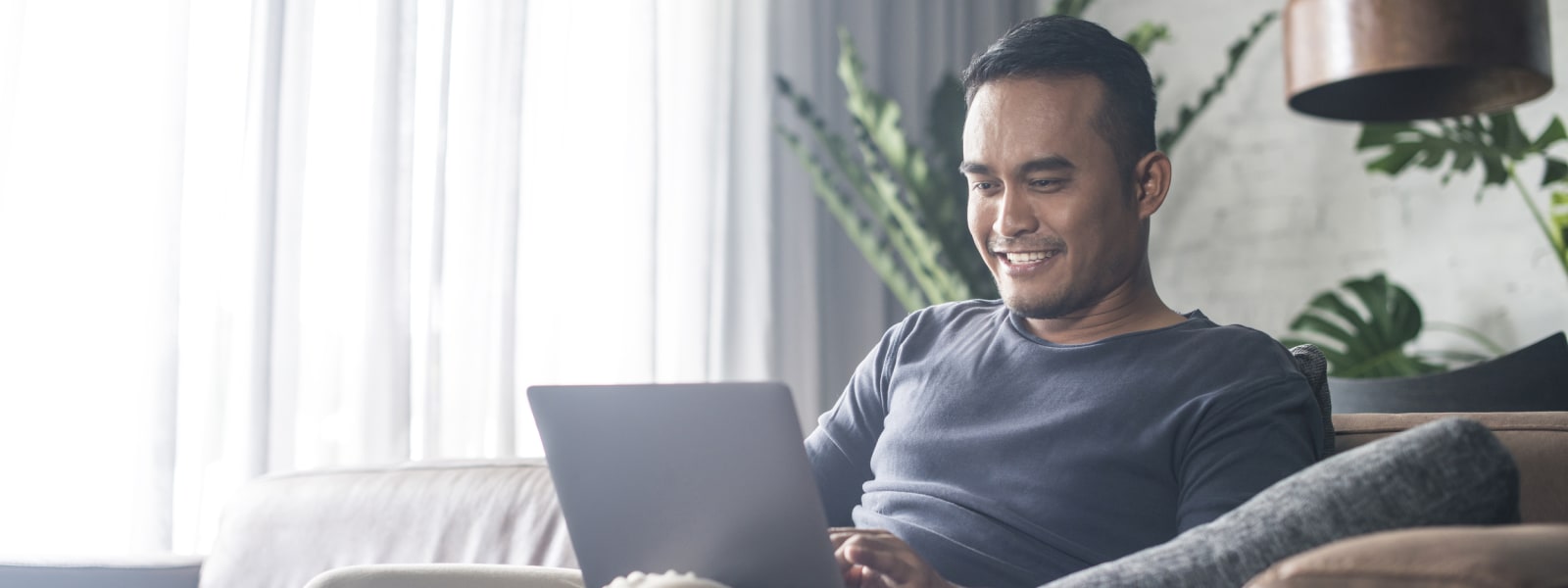 Young man working at home.