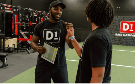 D1 Coach working with athlete
