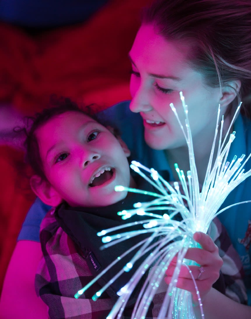 Girl enjoying sensory light experience