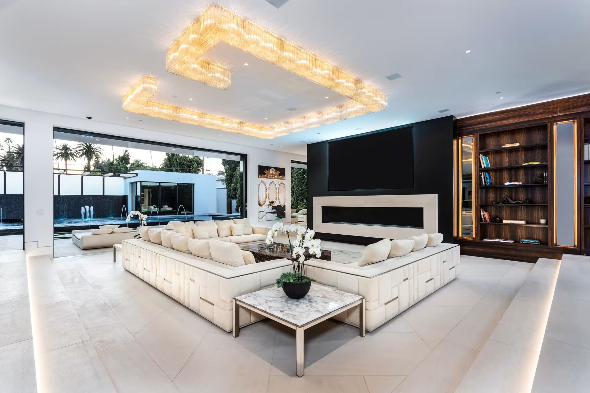 Luxury Custom Furniture for Modern Homes – Bespoke Interiors NYC Contemporary open-concept living room with custom sofas and luxury lighting, perfect for high-end homes in Florida and New York.
