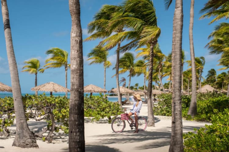 Girl on a bike on the beach