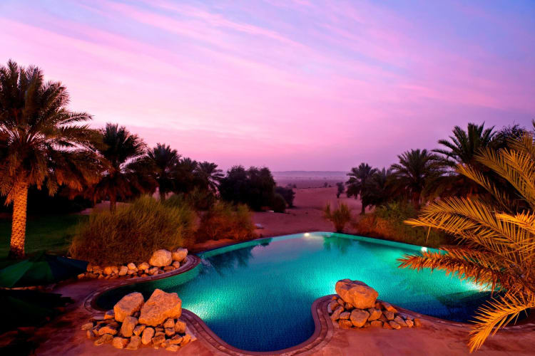 Pool and desert at dusk