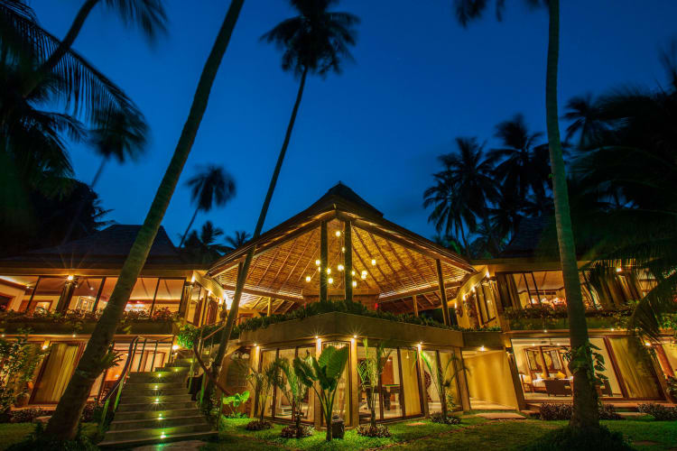 Villa lit up at night