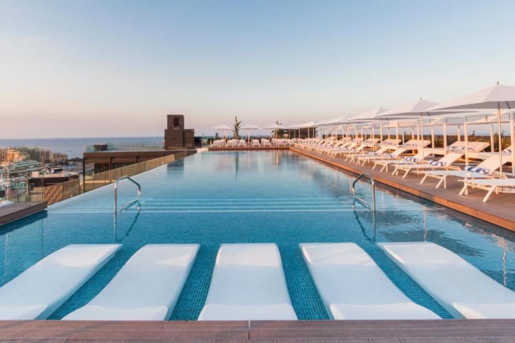 Sunbeds in pool