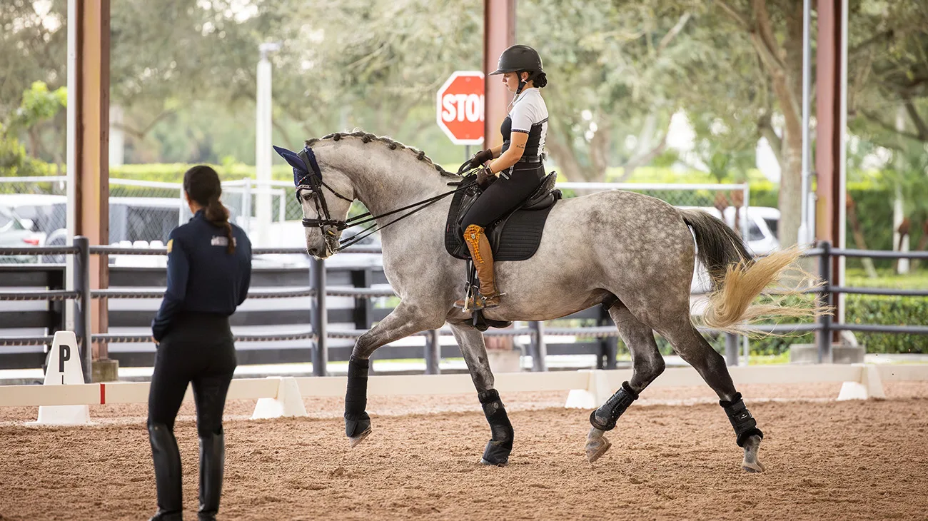 Jenaya Olsen rides with Ali Brock at the Robert Dover Horsemastership Clinic.