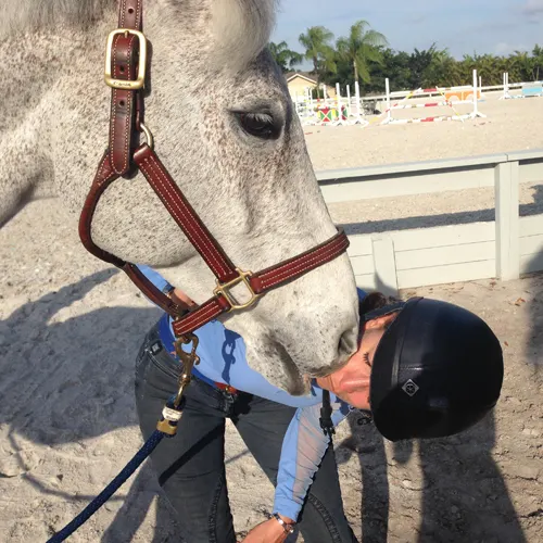 Laura Kraut gives Cedric a kiss. Photo by Ann Glavan