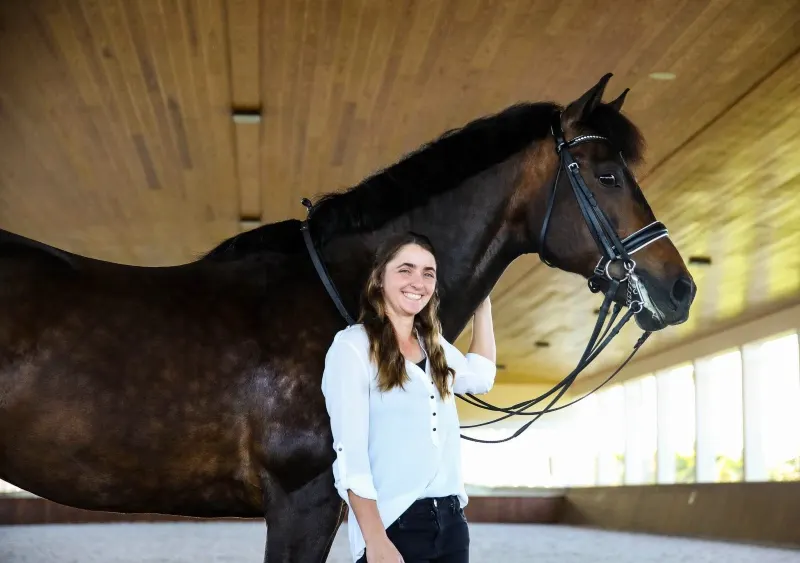 Monica Stanke boards her own horse, Cooper, in Wellington and cares for him before and after work each day. Annan Hepner Photo