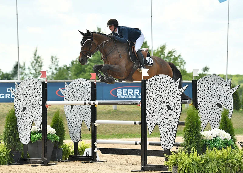 Cathleen Driscoll and Plain Bay Farm’s Dame de Pique riding to the win in the $73,800 CSIO2* Grand Prix at the Great Lakes Equestrian Festival in Traverse City (Michigan). Photo credit: Andrew Ryback Photography.