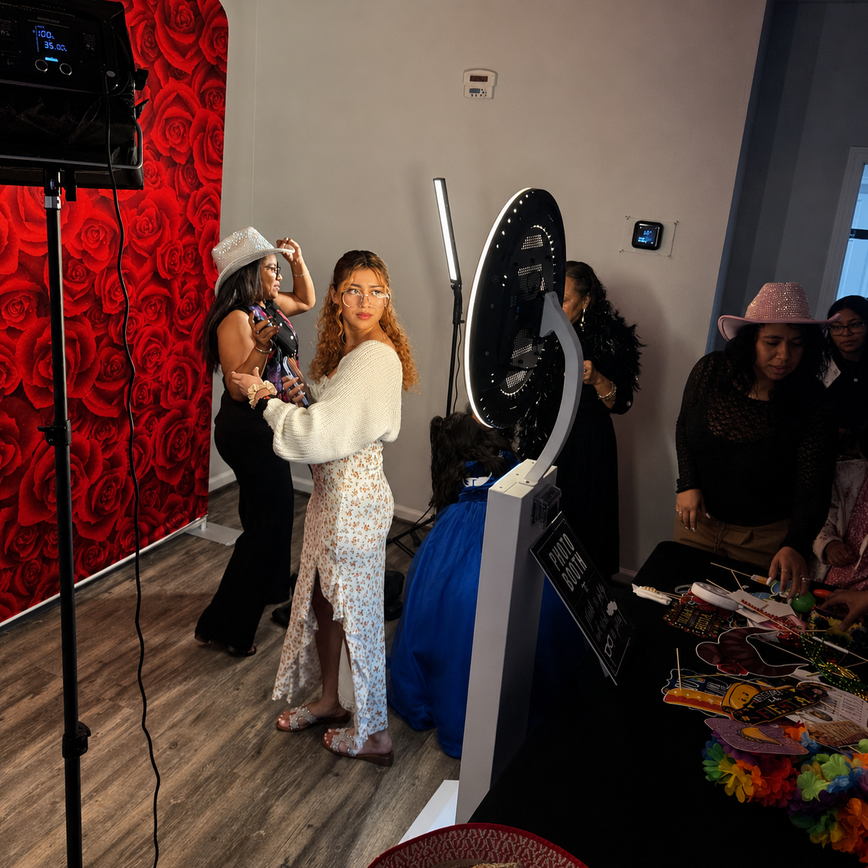 Mirror booth with red rose backdrop