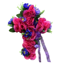 Silk flower arrangement shaped like a cross made with pink and purple flowers