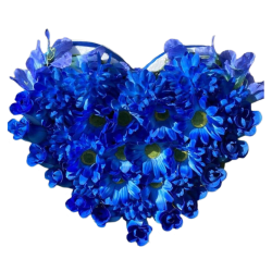 Silk flower arrangement shaped like a heart made with blue flowers