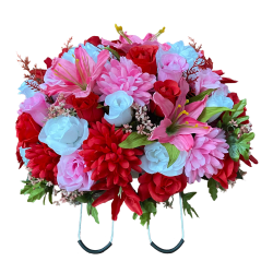 Silk flower saddle arrangement made with pink, red and white flowers