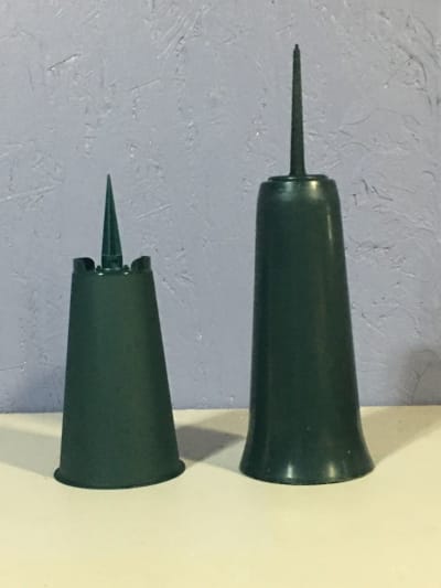 two green plastic cemetery vases
