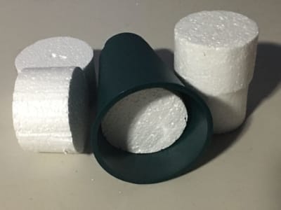 polystyrene circles cutouts that are used as bases for cemetery vase bouquets