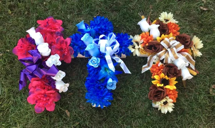 three silk flower cross arrangements