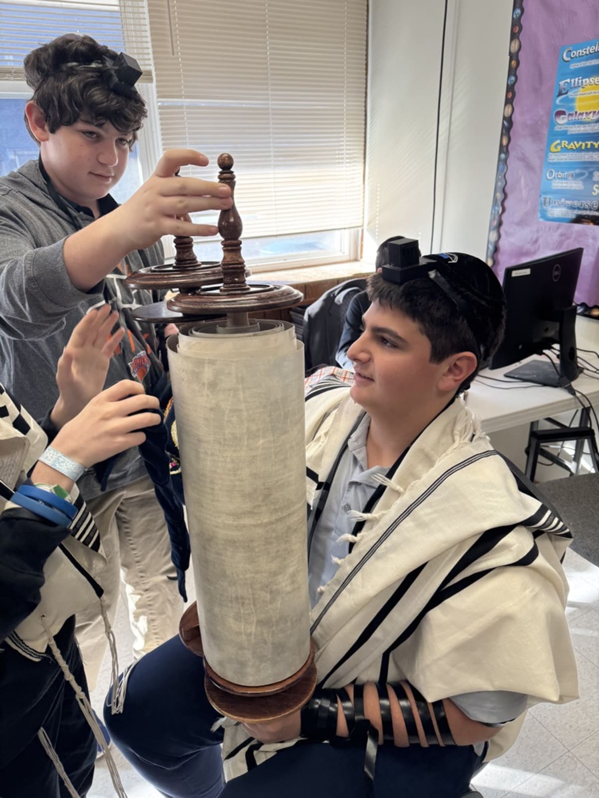 MHA high school students with Torah scroll