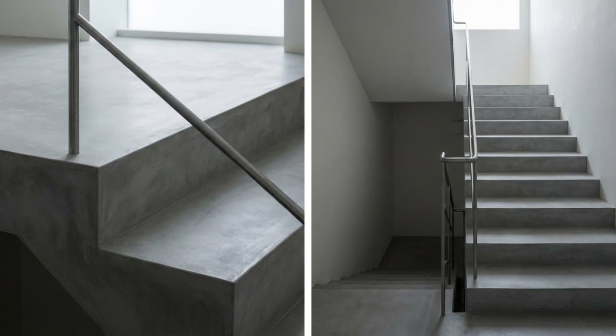 Mikrozement Treppe mit fugenlosen Stufen und Edelstahlgeländer