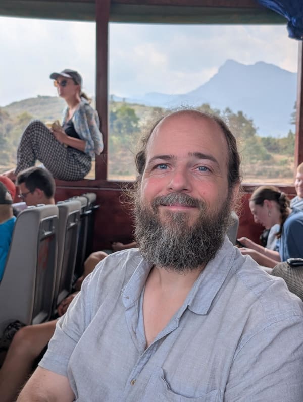 17_laos_chris_closeup_boat_n4mwbk