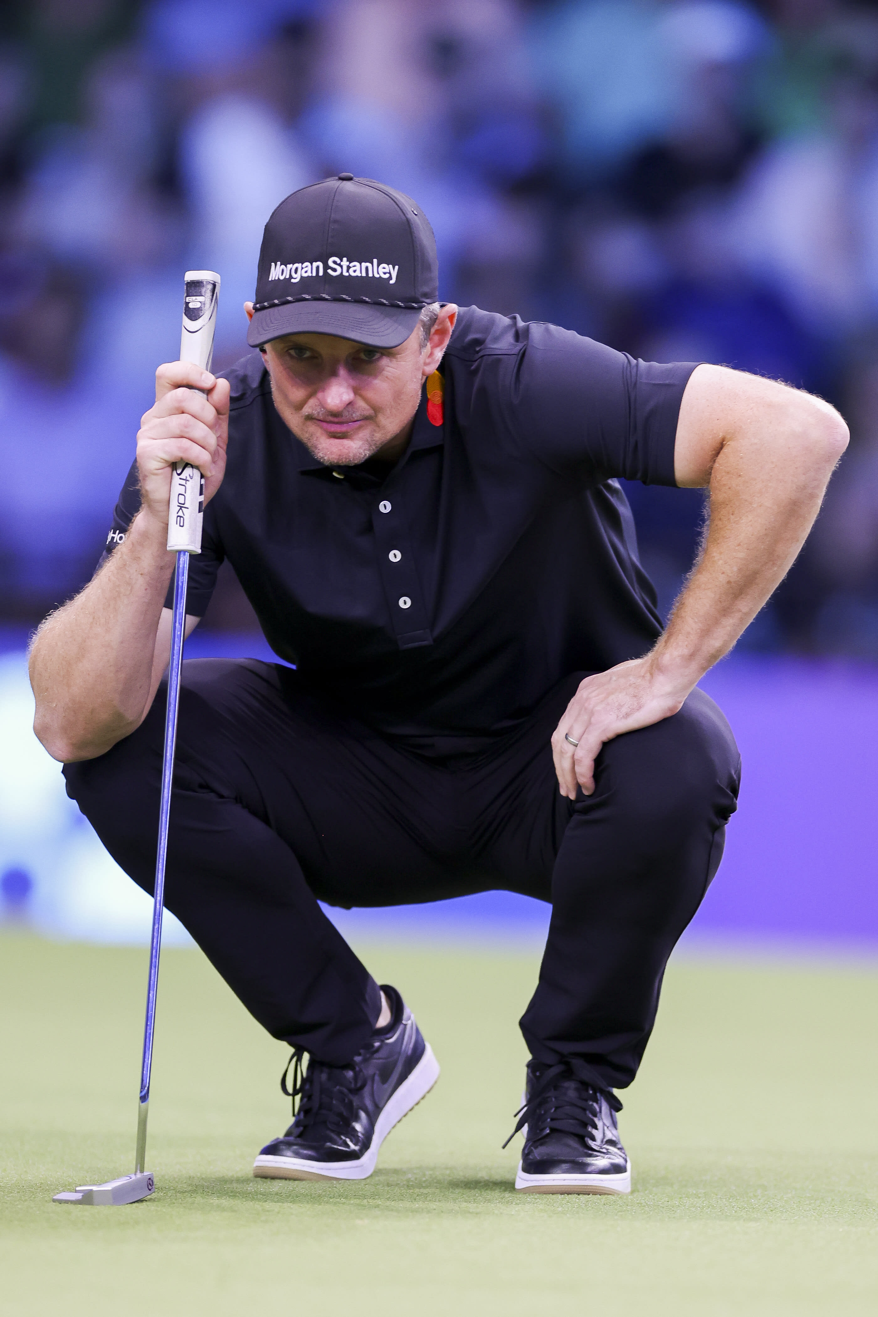 PALM BEACH GARDENS, FLORIDA - FEBRUARY 04: Justin Rose of Los Angeles Golf Club looks over a putt on the first hole during their TGL presented by SoFi match against Boston Common Golf at SoFi Center on February 04, 2025 in Palm Beach Gardens, Florida. (Photo by Brennan Asplen/TGL/TGL via Getty Images)