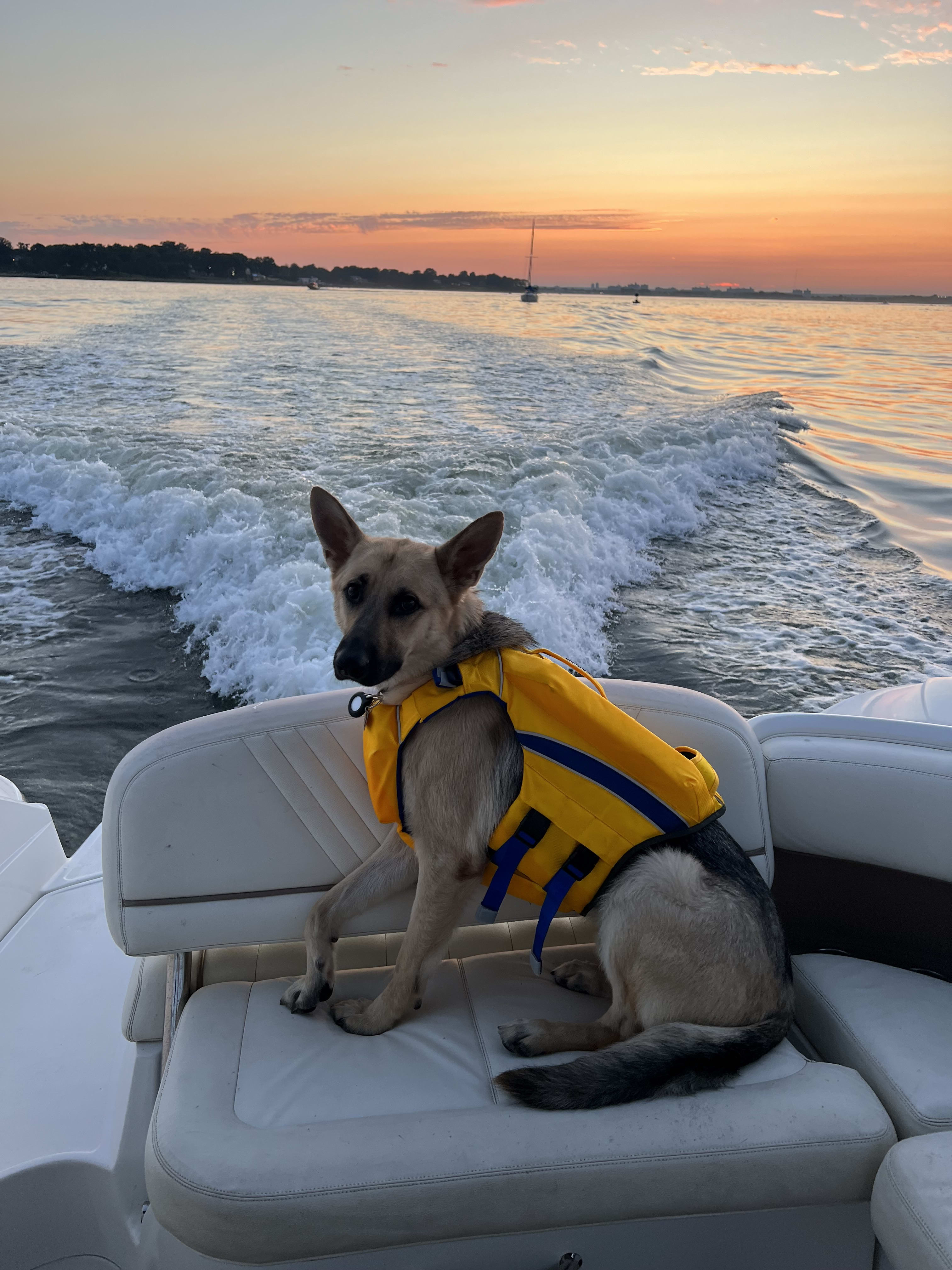 Kai on the boat at sunset