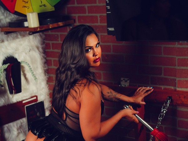 Looking over shoulder, brick wall — moody boudoir