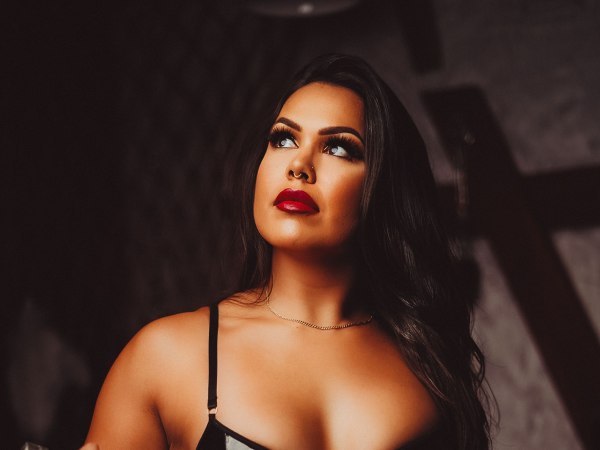 Black vinyl chain close-up — dark boudoir