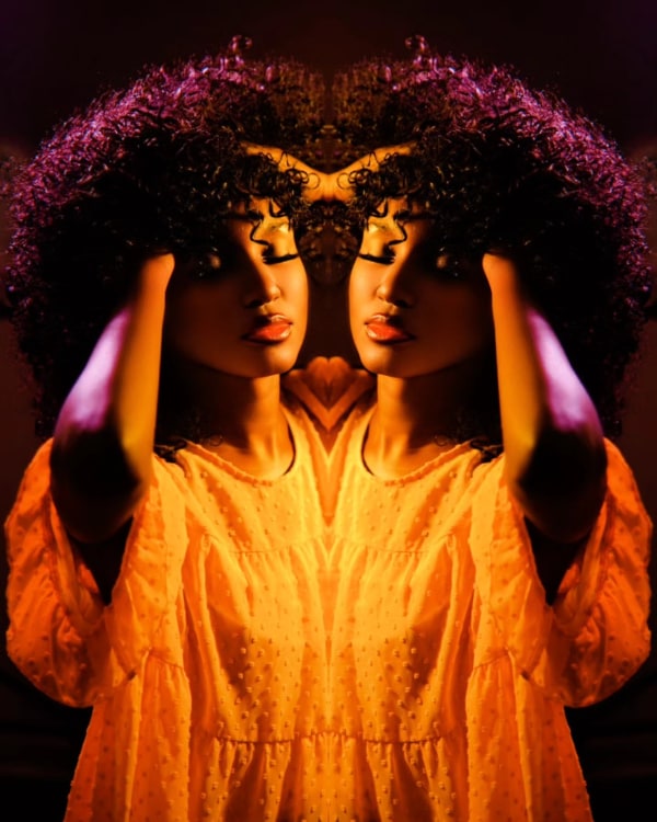 Mirrored kaleidoscopic portrait — creative editorial