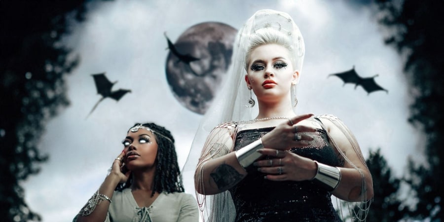 Two women with moon and dragons — fantasy composite