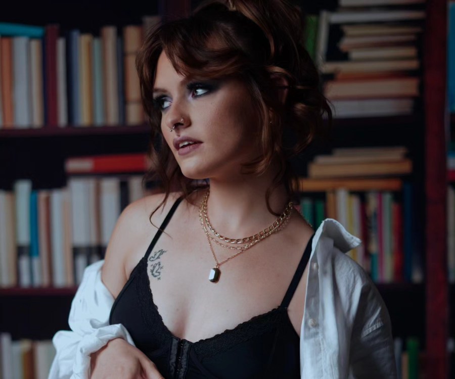 Library editorial portrait with bookshelves — Vigour Magazine