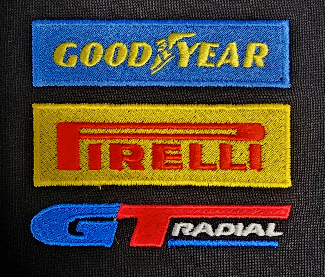 Clothing House embroidery — close detail of stitched logo on garment