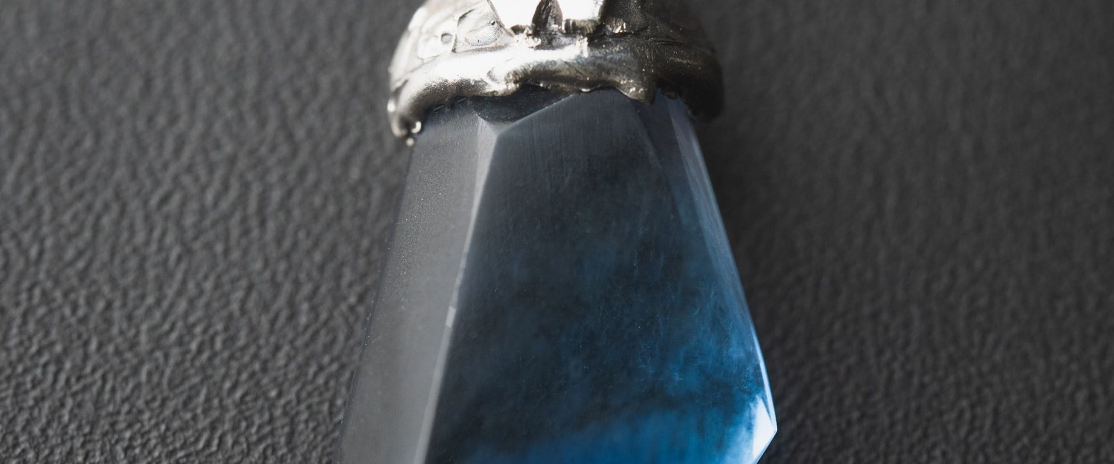 A cabochon moonstone with blue adularescence across its dome