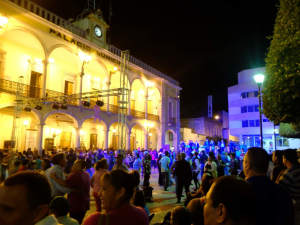 A fiesta in the main plaza at night