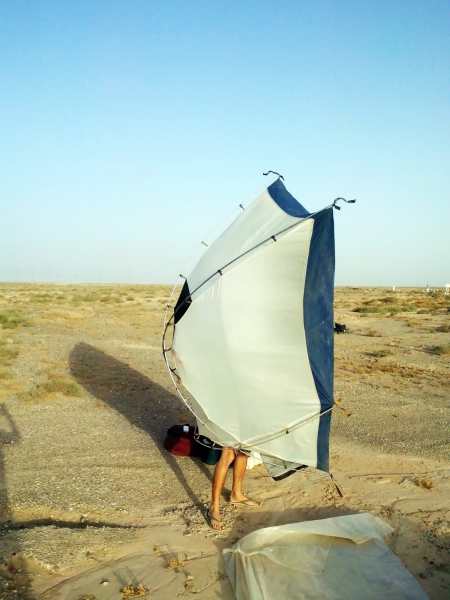 Yanez getting the sand out of his tent