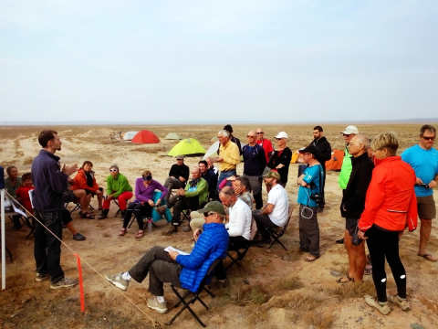 Shanny leads a rider meeting in the desert